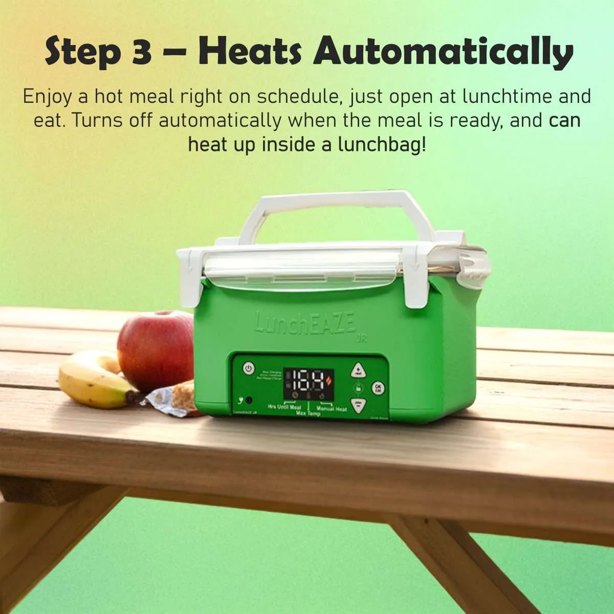 Green luncheaze JR on picnic table with apple and banana and other school snacks text reads: Step 3 – Heats Automatically Enjoy a hot meal right on schedule, just open at lunchtime and eat. Turns off automatically when the meal is ready, and can heat up inside a lunchbag!